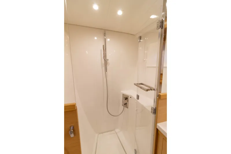 Why Not Yacht Photos Pics Modern shower in 2019 Lagoon 450F yacht, featuring sleek glass door and chrome fixtures.