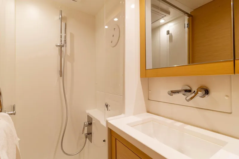 Why Not Yacht Photos Pics Modern bathroom in 2019 Lagoon 450F yacht with sleek fixtures and mirror.