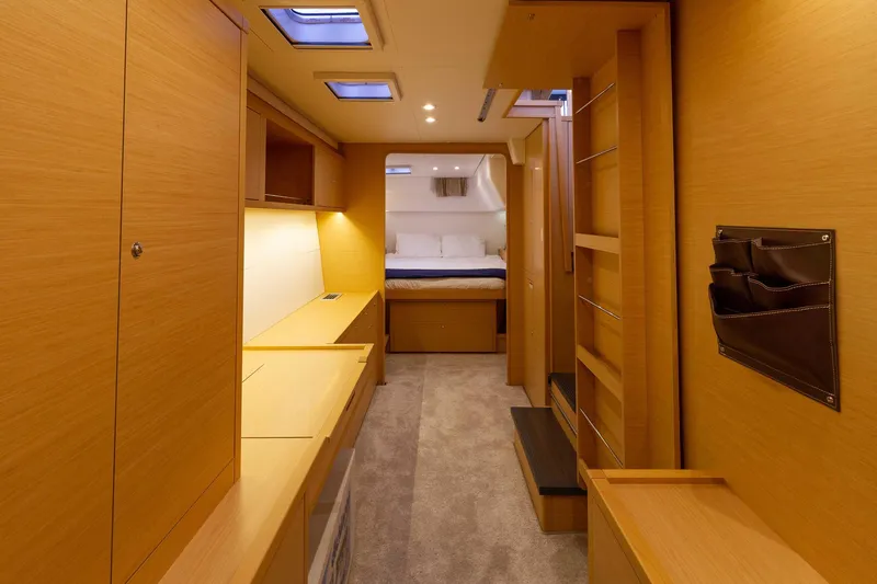 Why Not Yacht Photos Pics Luxurious interior of 2019 Lagoon 450F yacht with wood finish and cozy bedroom.