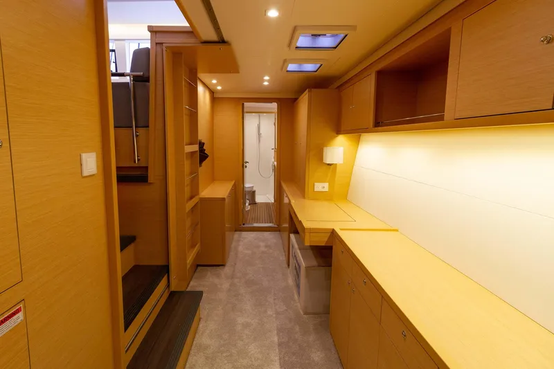 Why Not Yacht Photos Pics Interior of 2019 Lagoon 450F yacht, featuring modern wood cabinetry and ambient lighting.