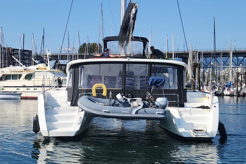 Why Not Yacht Photos Pics 2019 Lagoon 450F catamaran docked in marina with inflatable boat.