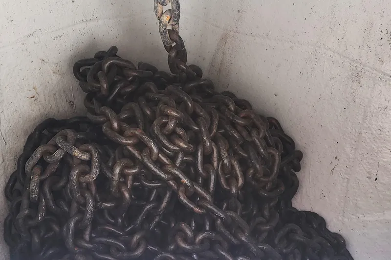 Why Not Yacht Photos Pics Rusty anchor chain in a compartment of a 2019 Lagoon 450F catamaran.