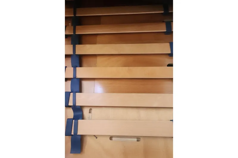 Why Not Yacht Photos Pics Wooden slats with blue connectors, part of a 2019 Lagoon 450F interior.