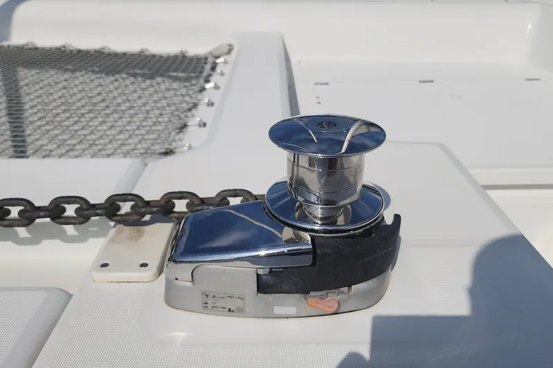 Why Not Yacht Photos Pics Anchor winch on 2019 Lagoon 450F catamaran deck, featuring chain and netting.