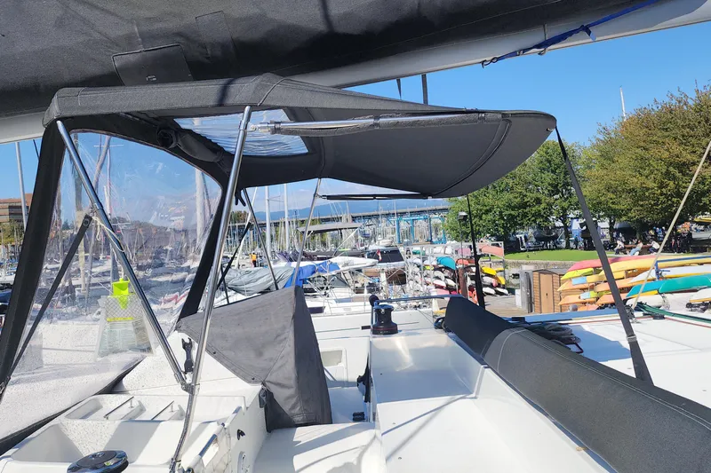 Why Not Yacht Photos Pics 2019 Lagoon 450F catamaran at marina, featuring cockpit and canopy.