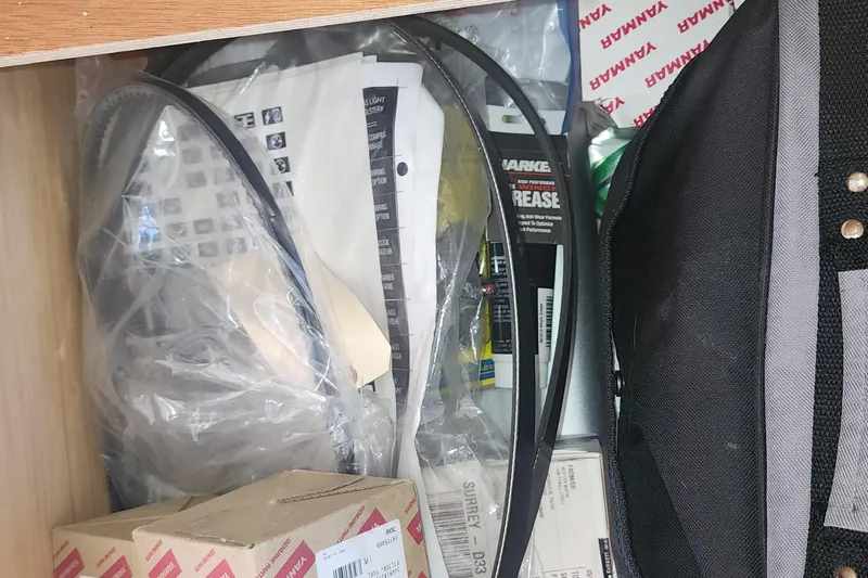 Why Not Yacht Photos Pics Storage compartment with various boat maintenance items for a 2019 Lagoon 450F.