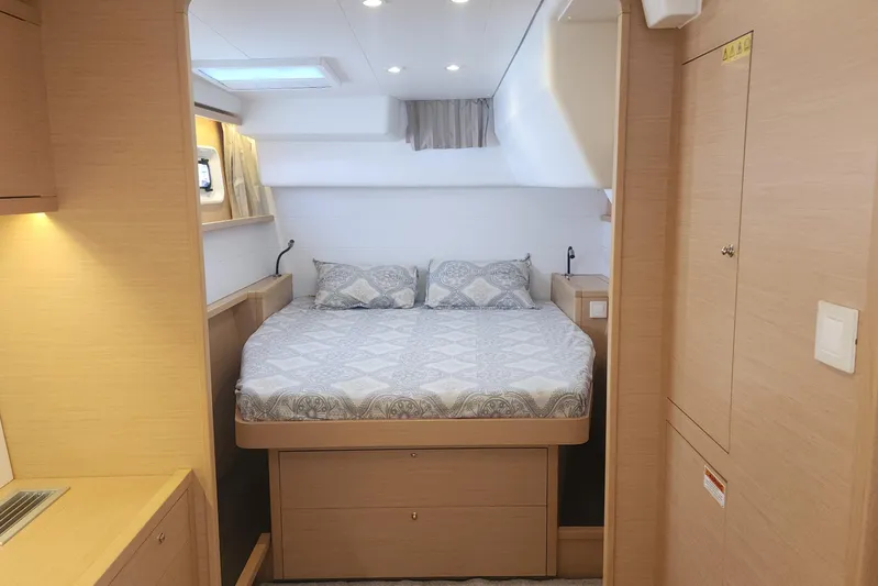 Why Not Yacht Photos Pics Luxurious cabin interior of 2019 Lagoon 450F catamaran with cozy bed and modern design.