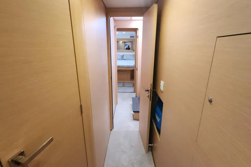 Why Not Yacht Photos Pics Hallway inside 2019 Lagoon 450F yacht, leading to a cozy bedroom.