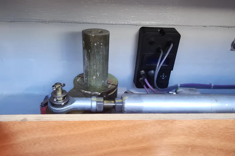 Why Not Yacht Photos Pics Steering mechanism of a 2019 Lagoon 450F yacht, featuring hydraulic components and wiring.