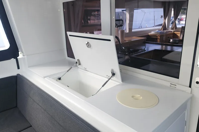 Why Not Yacht Photos Pics Interior of 2019 Lagoon 450F yacht, featuring a sleek kitchen area with open storage.