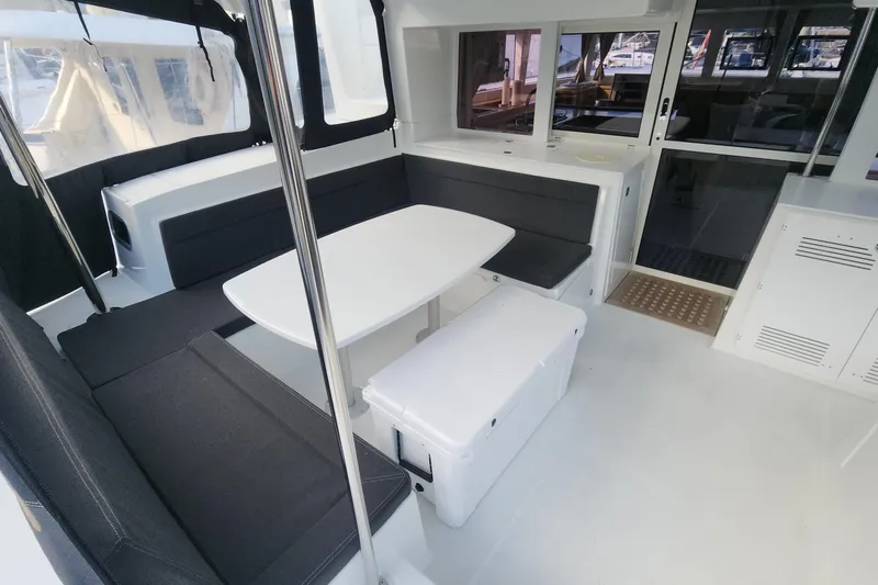 Why Not Yacht Photos Pics Spacious interior of 2019 Lagoon 450F catamaran with modern seating and dining area.