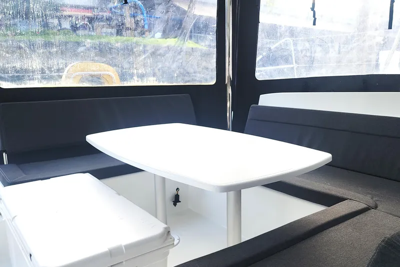 Why Not Yacht Photos Pics Interior of 2019 Lagoon 450F yacht with seating and table.