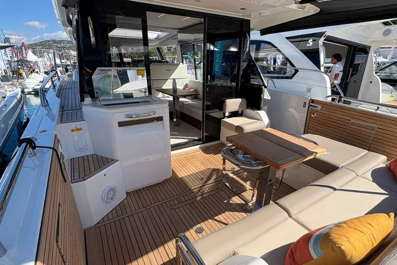  Yacht Photos Pics 2026 Wellcraft 44 Explorer yacht interior with modern seating and wooden deck.
