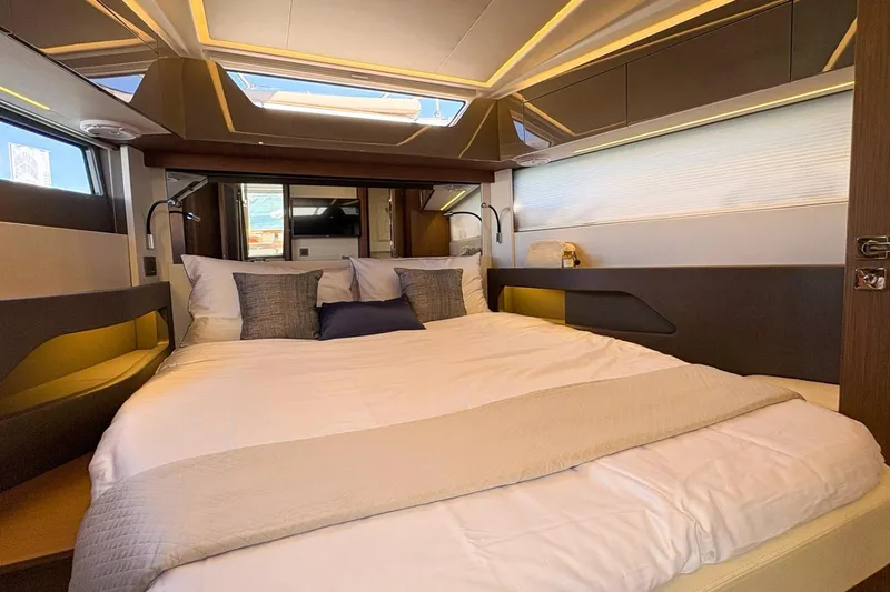  Yacht Photos Pics Luxurious bedroom interior of 2026 Wellcraft 44 Explorer yacht with modern design.