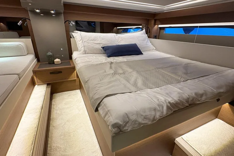  Yacht Photos Pics Luxurious cabin interior of 2026 Wellcraft 44 Explorer yacht with cozy bed and modern design.