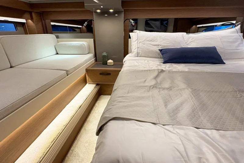  Yacht Photos Pics Luxurious interior of 2026 Wellcraft 44 Explorer yacht with bed and seating area.