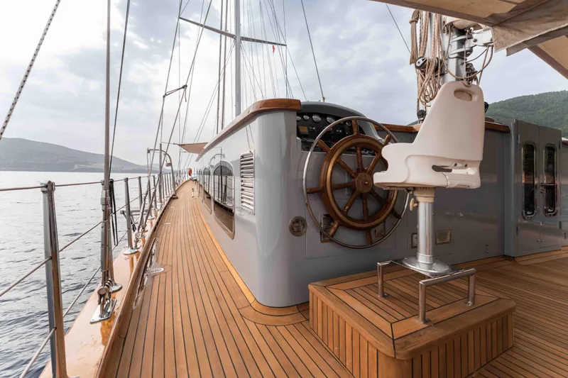 Le Pietre Yacht Photos Pics Luxurious 2009 custom sailing yacht with wooden deck and steering wheel.