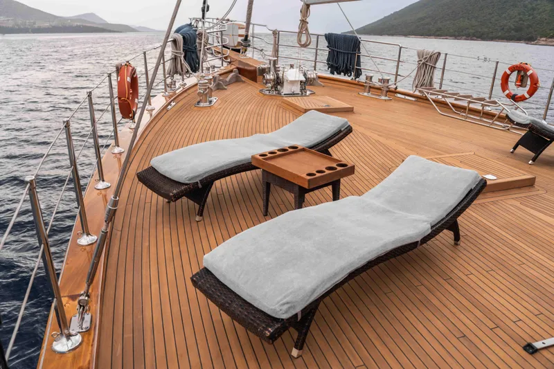Le Pietre Yacht Photos Pics Luxurious deck of 2009 custom sailing yacht with sun loungers and ocean view.