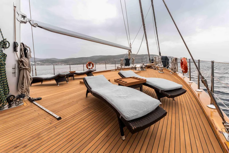 Le Pietre Yacht Photos Pics Spacious deck of a 2009 Custom Sailing Yacht with lounge chairs and ocean view.