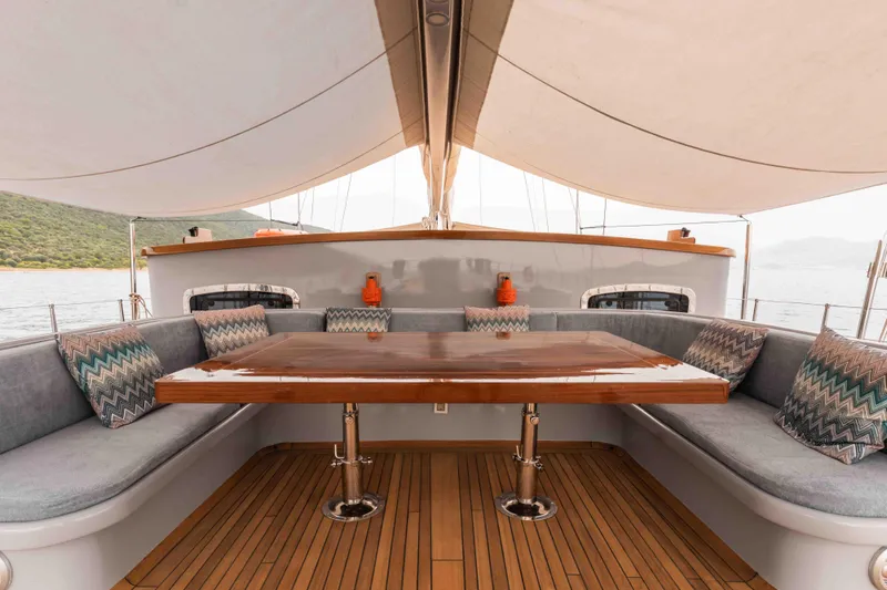 Le Pietre Yacht Photos Pics Luxurious 2009 custom sailing yacht with spacious outdoor seating and elegant wooden table.