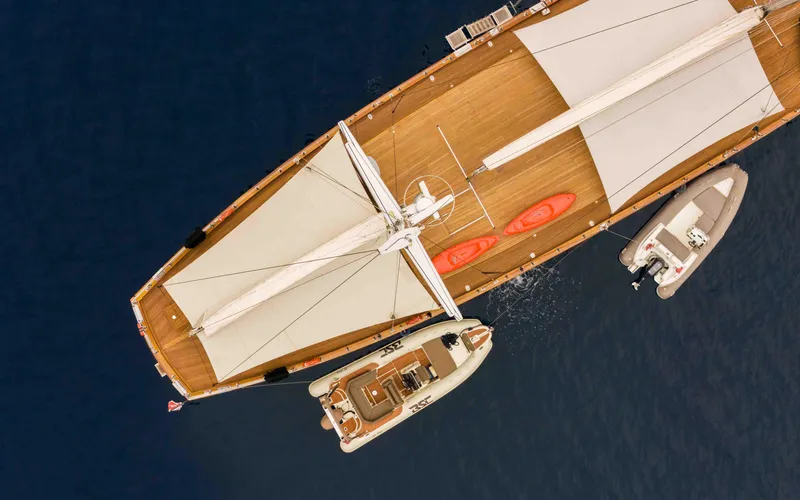 Le Pietre Yacht Photos Pics Aerial view of a 2009 Custom Sailing Yacht with two kayaks and a tender boat.