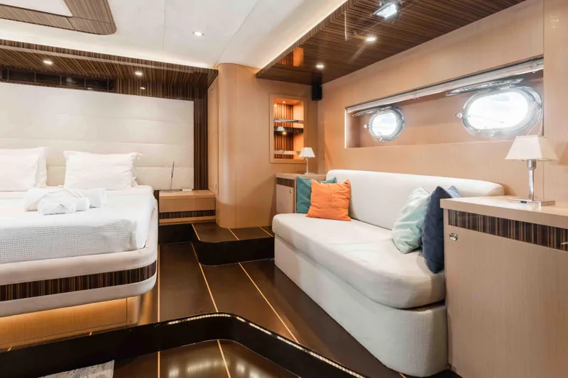 Le Pietre Yacht Photos Pics Luxurious interior of a 2009 custom sailing yacht with modern furnishings and porthole windows.