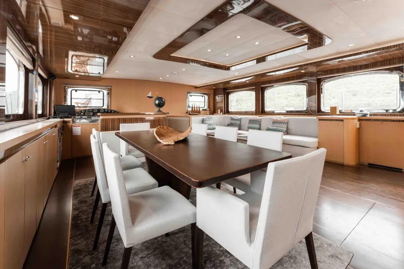 Le Pietre Yacht Photos Pics Luxurious interior of a 2009 custom sailing yacht with modern dining area and large windows.