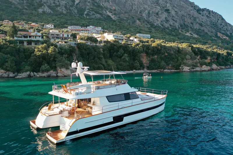  Yacht Photos Pics Luxury Fountaine Pajot Queensland 55 yacht cruising near scenic coastline, 2010 model.