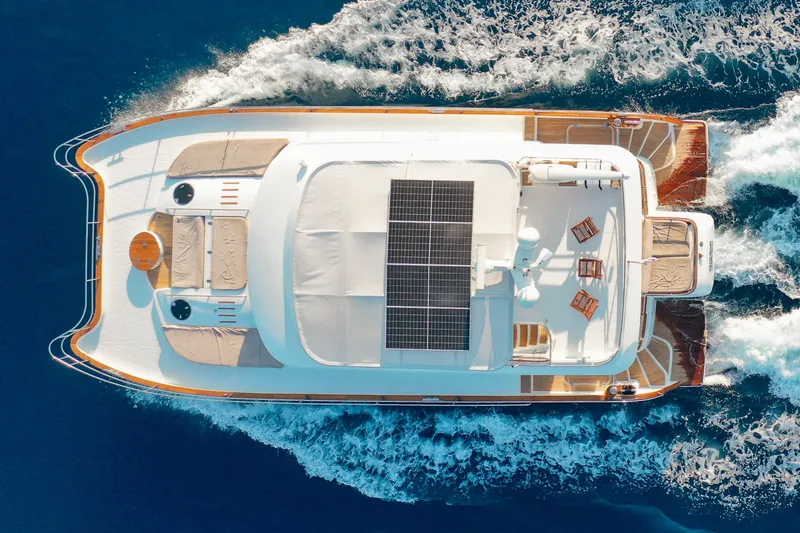  Yacht Photos Pics Aerial view of 2010 Fountaine Pajot Queensland 55 yacht cruising on the ocean.