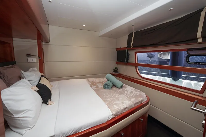  Yacht Photos Pics Luxurious cabin interior of 2010 Fountaine Pajot Queensland 55 yacht with cozy bedding.