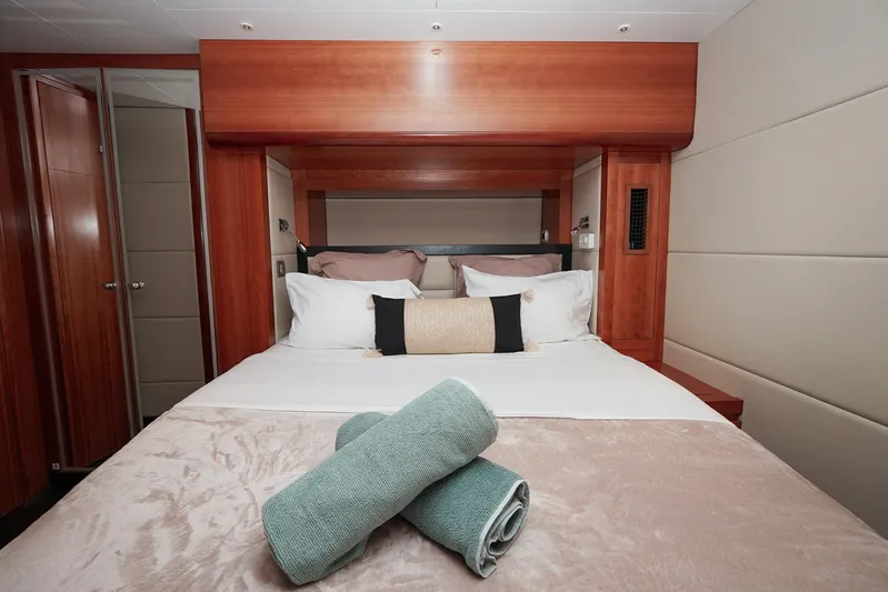  Yacht Photos Pics Luxurious bedroom interior of 2010 Fountaine Pajot Queensland 55 yacht with neatly arranged towels.