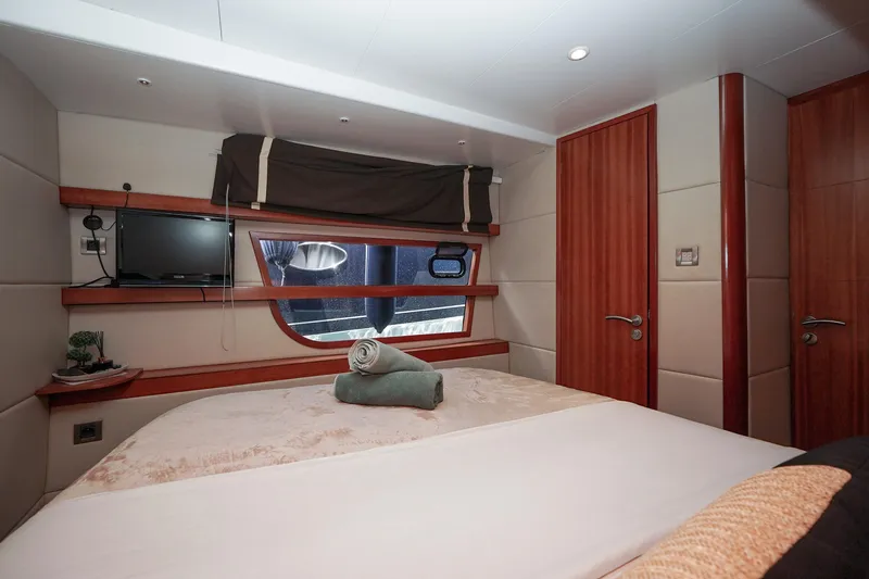  Yacht Photos Pics Luxurious cabin interior of 2010 Fountaine Pajot Queensland 55 yacht with cozy bed and window view.