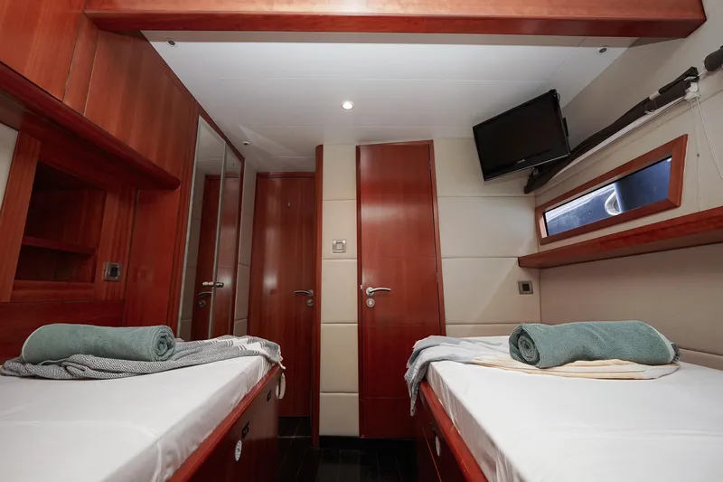  Yacht Photos Pics Luxurious cabin interior of 2010 Fountaine Pajot Queensland 55 yacht with twin beds.