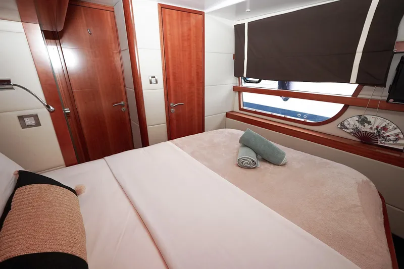  Yacht Photos Pics Luxurious cabin interior of 2010 Fountaine Pajot Queensland 55 yacht with elegant wood finishes.