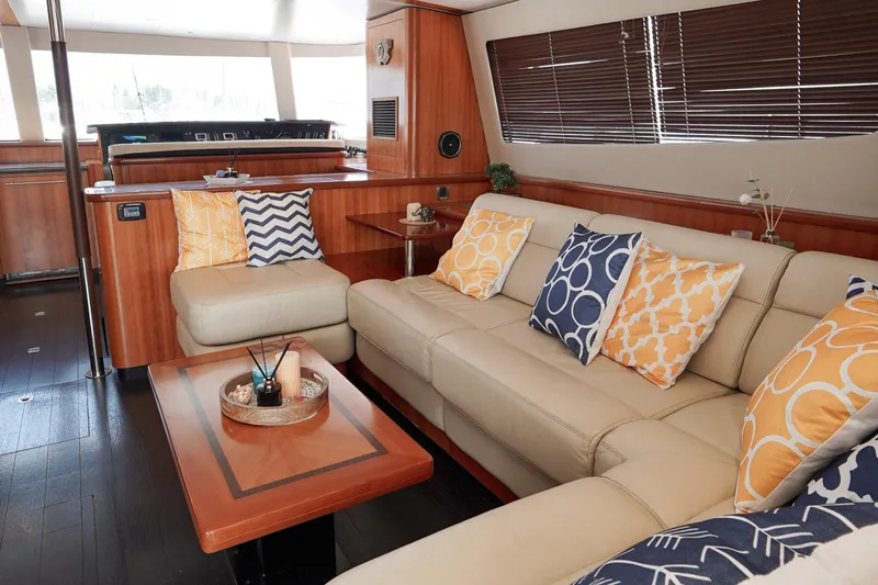  Yacht Photos Pics Luxurious interior of 2010 Fountaine Pajot Queensland 55 yacht with stylish cushions and wooden accents.