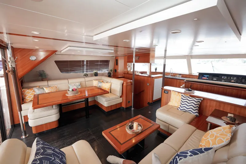  Yacht Photos Pics Luxurious interior of 2010 Fountaine Pajot Queensland 55 yacht with elegant seating and decor.