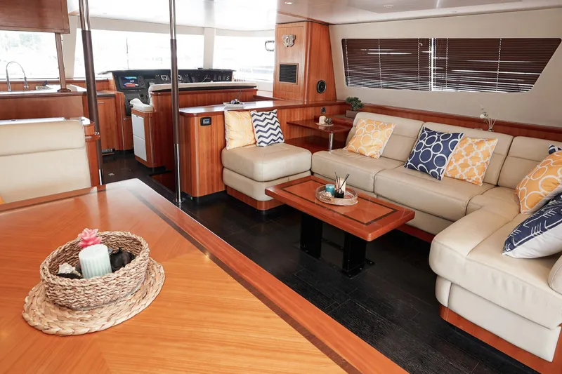  Yacht Photos Pics Luxurious interior of 2010 Fountaine Pajot Queensland 55 yacht with elegant seating and decor.