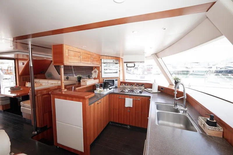  Yacht Photos Pics Luxurious kitchen interior of 2010 Fountaine Pajot Queensland 55 yacht with modern amenities.