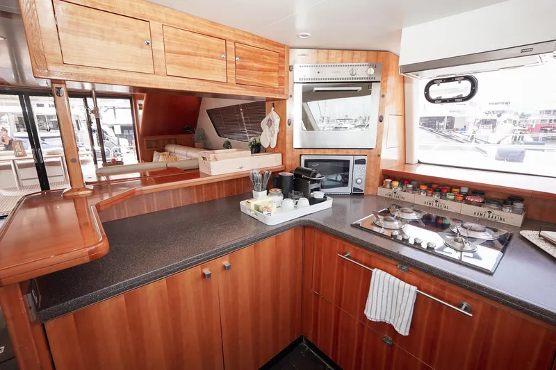  Yacht Photos Pics Luxurious kitchen interior of 2010 Fountaine Pajot Queensland 55 yacht with modern appliances.