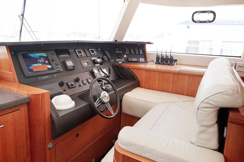  Yacht Photos Pics Helm station of 2010 Fountaine Pajot Queensland 55 yacht with modern navigation equipment.