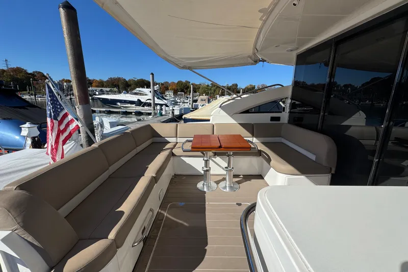  Yacht Photos Pics Luxurious 2015 Viking Princess V52 yacht with spacious outdoor seating and elegant table.