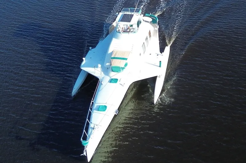 Jonny Wasabi Yacht Photos Pics Aerial view of a 2002 Custom 64 Stuart Catamarans sailing on water.