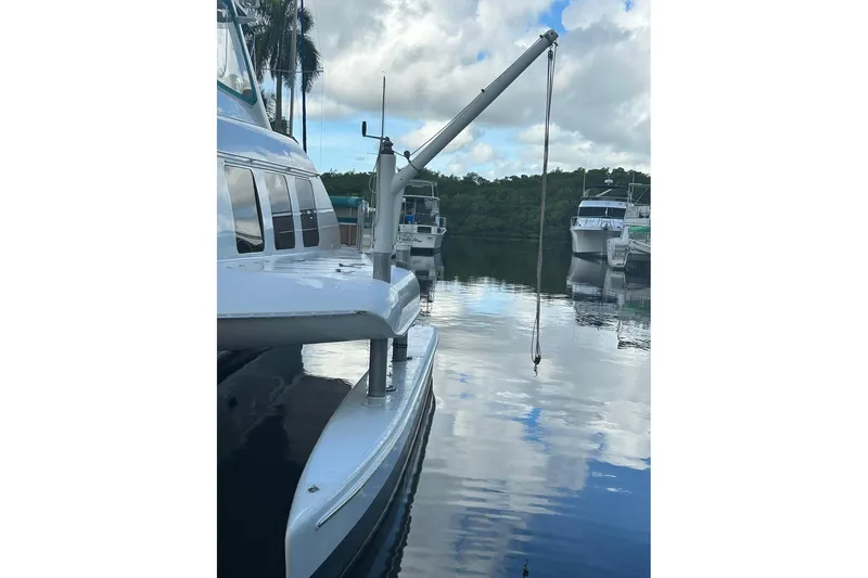 Jonny Wasabi Yacht Photos Pics Custom 64 Stuart Catamarans, 2002 model, docked with calm water reflections.