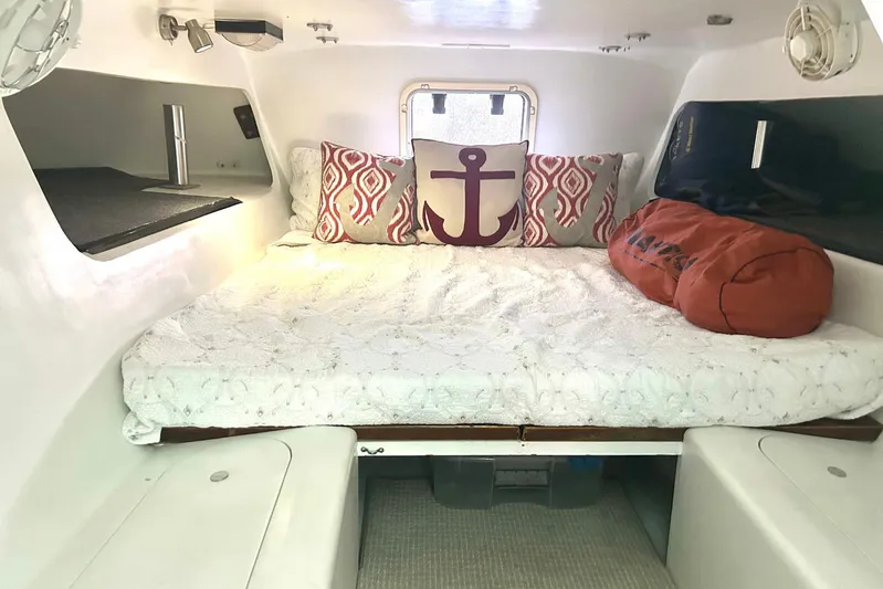 Jonny Wasabi Yacht Photos Pics Cozy cabin interior of 2002 Custom 64 Stuart Catamarans with nautical-themed decor.