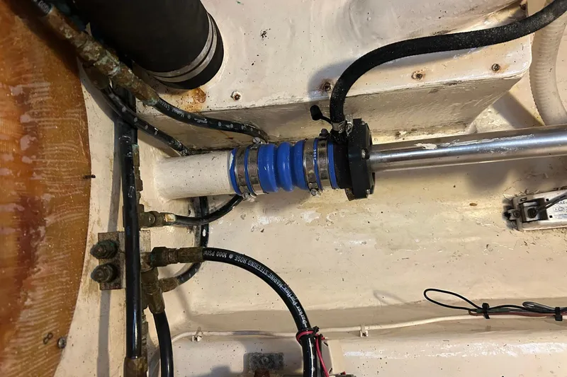 Jonny Wasabi Yacht Photos Pics Engine compartment of 2002 Custom 64 Stuart Catamarans, showing mechanical components and hoses.