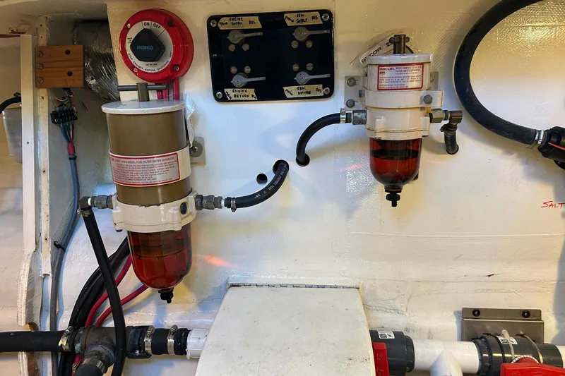 Jonny Wasabi Yacht Photos Pics Engine room of 2002 Custom 64 Stuart Catamarans with fuel filters and wiring.