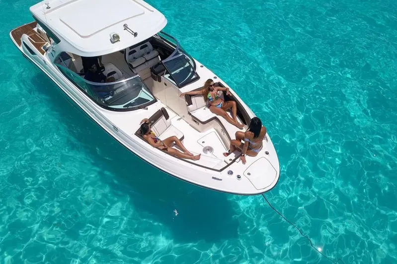  Yacht Photos Pics 2017 Sea Ray SLX 350 boat with passengers relaxing on clear turquoise water.