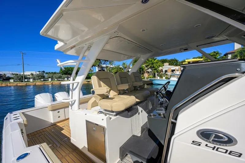 Leap Year Yacht Photos Pics 2018 Pursuit S 408 Sport boat interior with helm seats and sleek design.