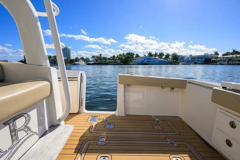 Leap Year Yacht Photos Pics 2018 Pursuit S 408 Sport boat interior with scenic waterfront view.