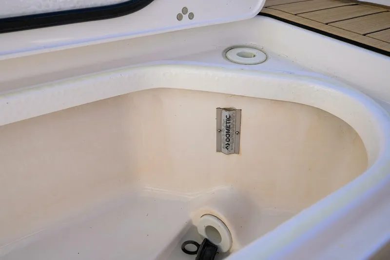 Leap Year Yacht Photos Pics Storage compartment in 2018 Pursuit S 408 Sport boat with Dometic label.